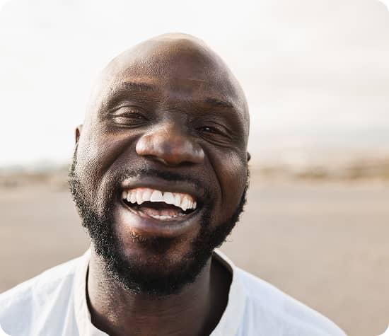 Close-up of a person smiling into the camera