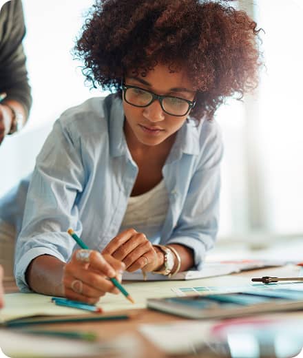 Person drawing in an office setting