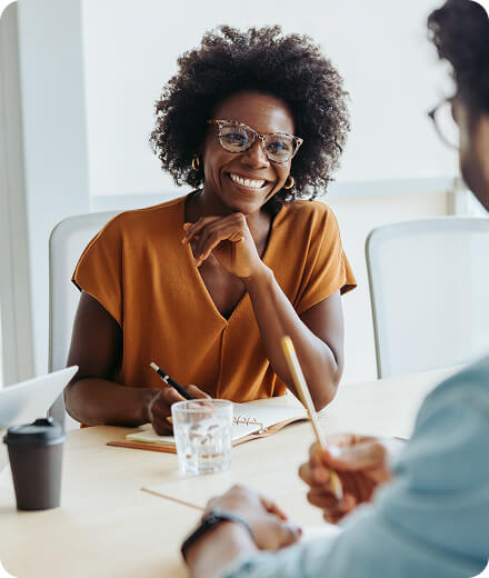 Two people talking in an office setting