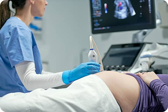 Image of an ultrasound being done on a patient's stomach