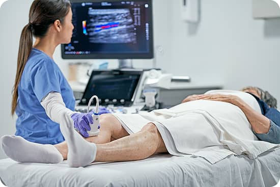 Image of an ultrasound being done on a patient's calf