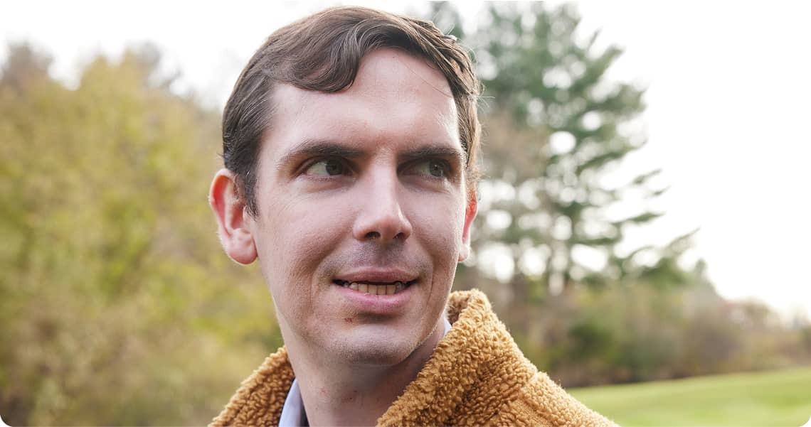 Close-up headshot of someone looking off to the side